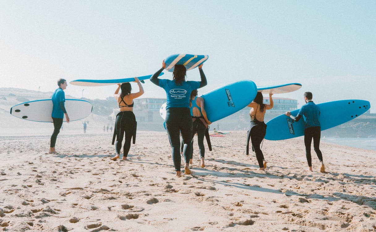 A group of Surfer ready to go Surfing.
